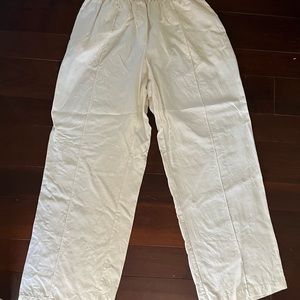 Linen drawstring pleated pants by Gentle Herd in cream.